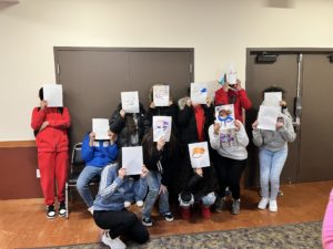 Students pose as their mutating bunnies